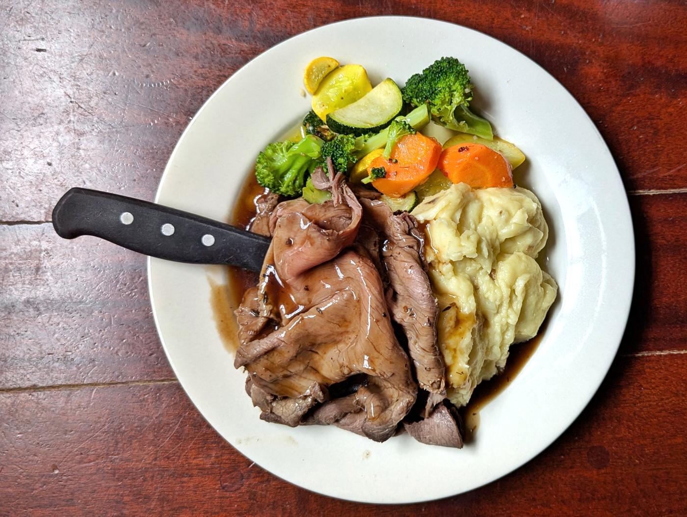 Roast beef with gravy, mashed potato, and vegetables - Massachusetts